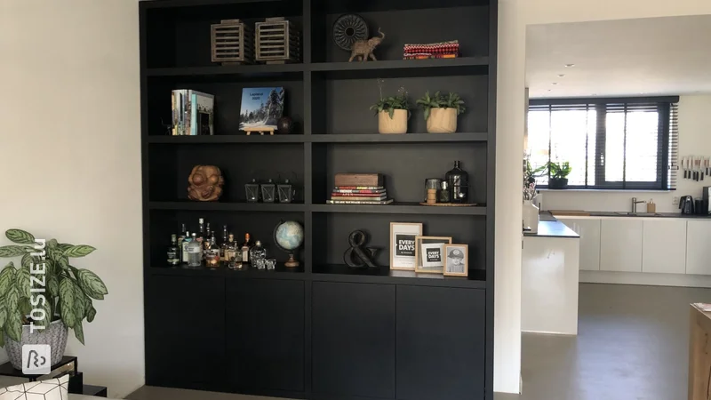 A matte black wall cabinet made to measure, by Suzanne