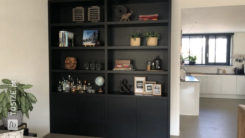 A matte black wall cabinet made to measure, by Suzanne