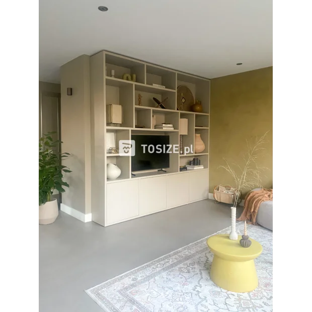 Beige cupboard wall with open compartments and doors