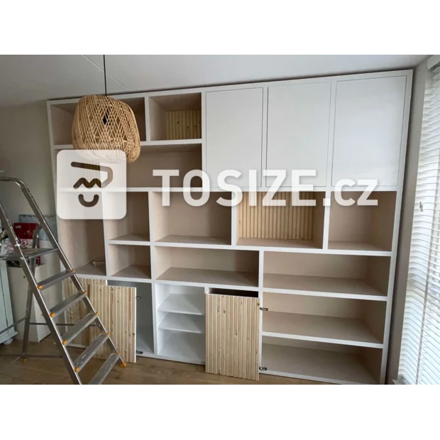 White cupboard wall with doors and open compartments