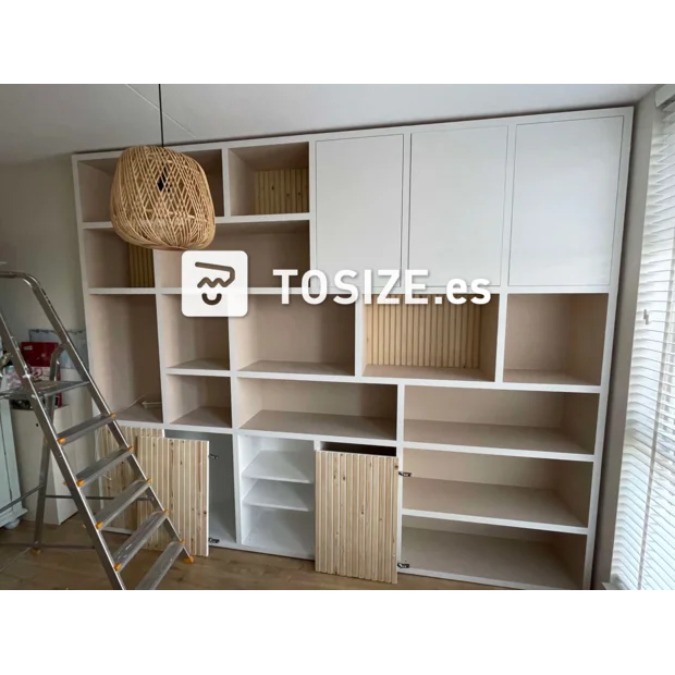 White cupboard wall with doors and open compartments