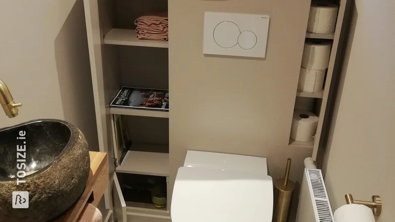 A homemade toilet cabinet with handy storage compartments, by Geert