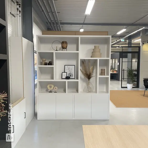 White cupboard wall with doors and open compartments