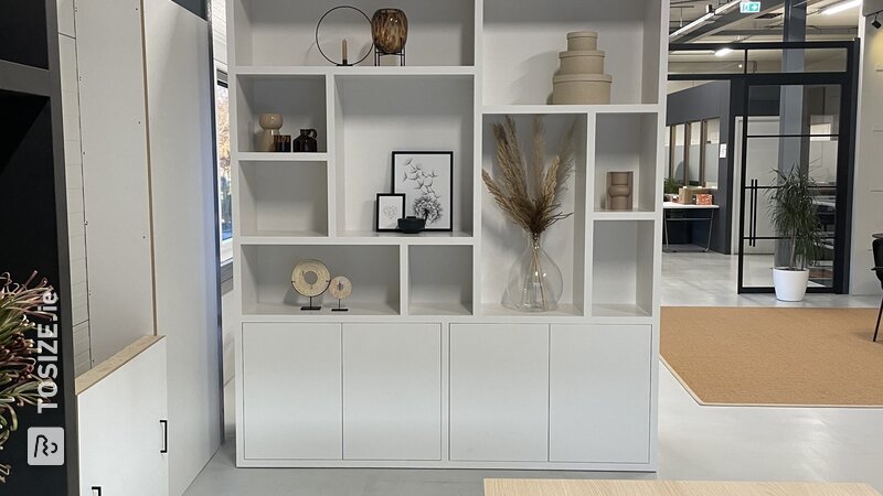 Sleek, white bespoke shelving unit inspired by Marjolein and Daniëlle