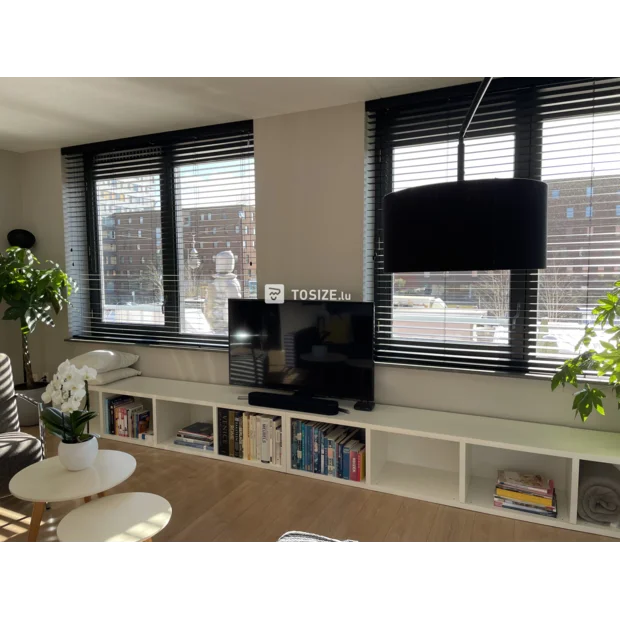 White TV cabinet with open compartments and shelves