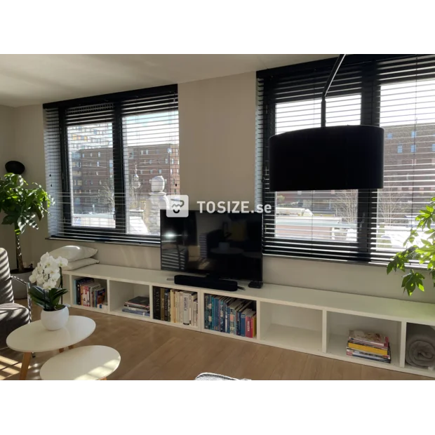 White TV cabinet with open compartments and shelves