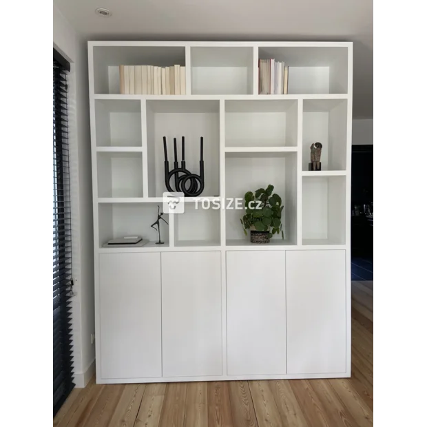 White cupboard wall with doors and open compartments