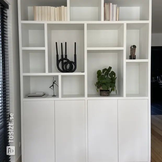 White cupboard wall with doors and open compartments