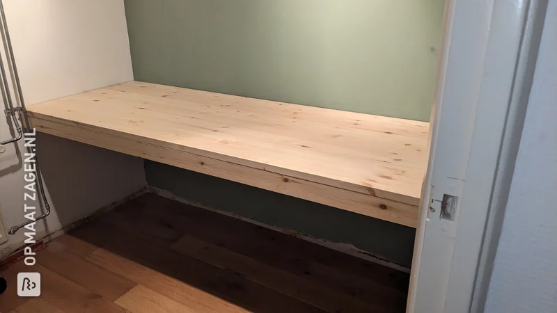 A homemade large floating desk made of pine wood carpentry panel, by Ingmar