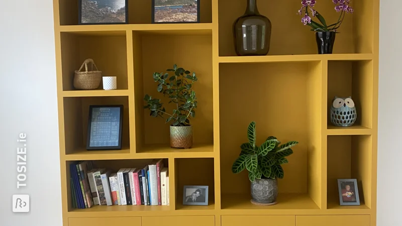 An ocher yellow TOSIZE Furniture custom cabinet, by Kim