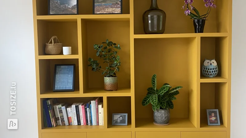 An ocher yellow TOSIZE Furniture custom cabinet, by Kim