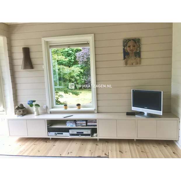 Cream TV cabinet with doors and open compartments