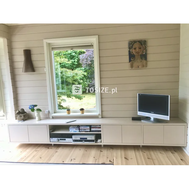 Cream TV cabinet with doors and open compartments