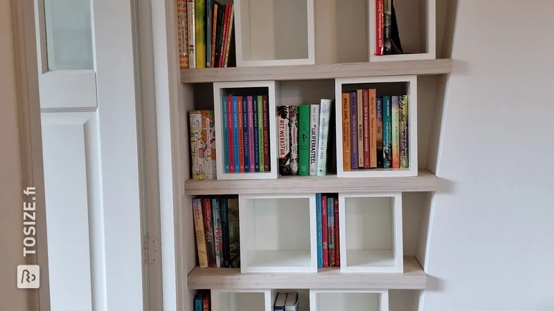 A unique homemade custom bookcase for next to the mantelpiece, by Erik