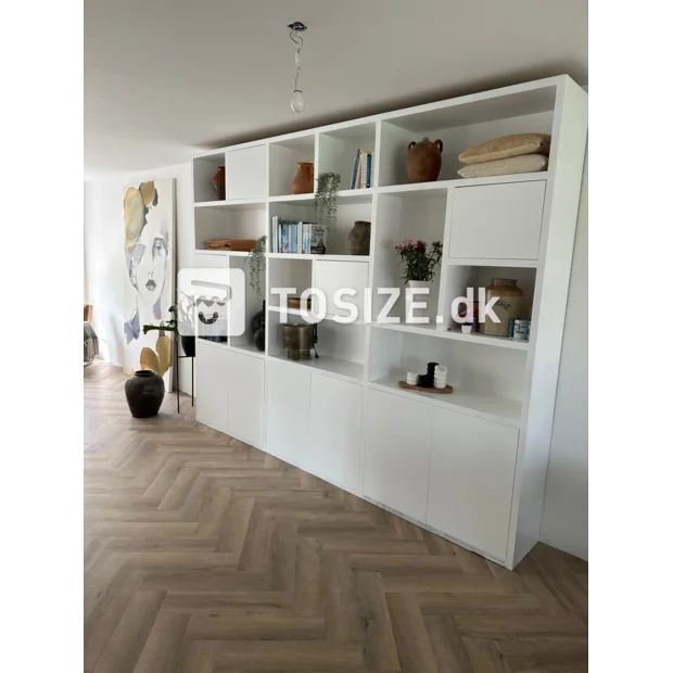 White cupboard wall with open compartments and doors