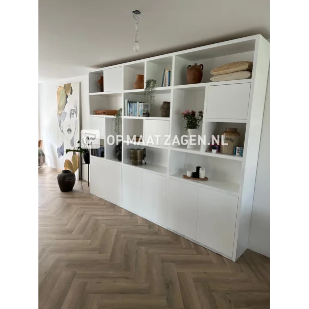 White cupboard wall with open compartments and doors