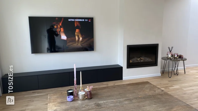 A sleek black TV cabinet made to measure from MDF, by Karen