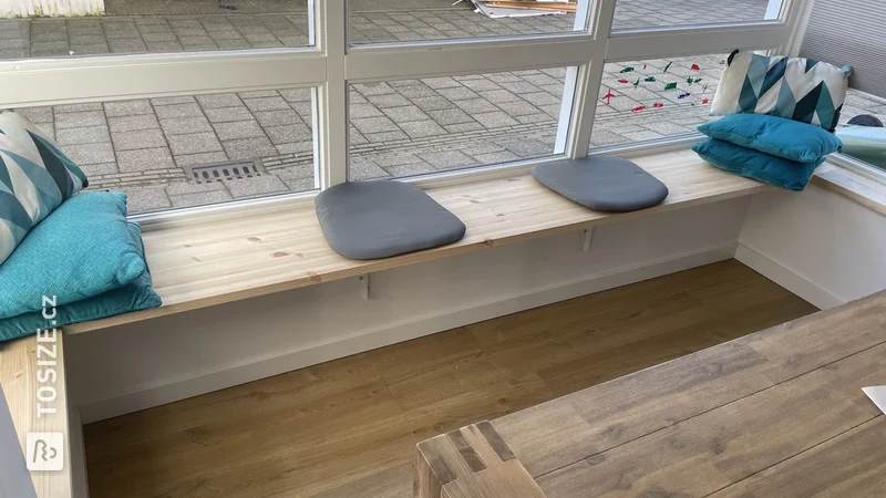 A custom shoe cabinet made of MDF and a seat for the bay window, by Andy