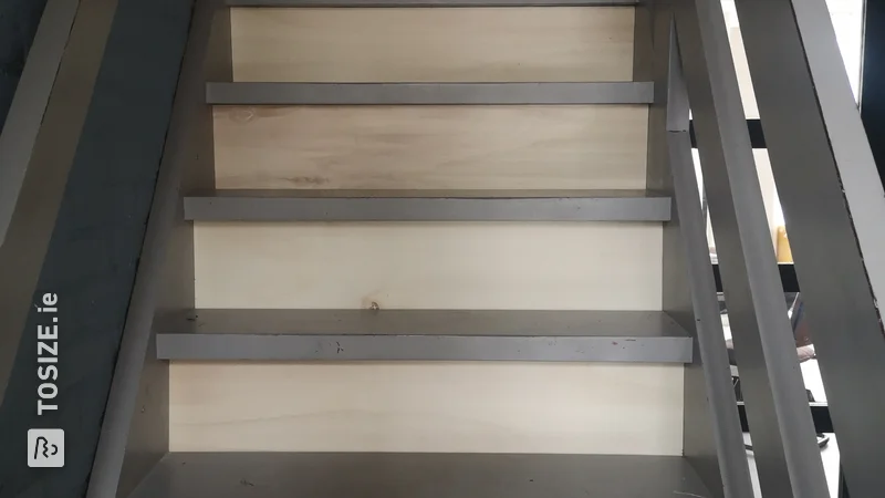Close the steps of an open staircase yourself with custom sawn panels, by Susan