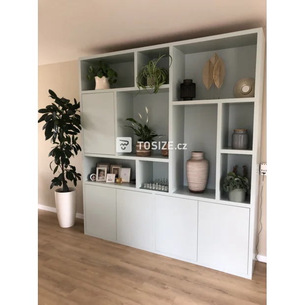 Light green cupboard wall with doors and open compartments