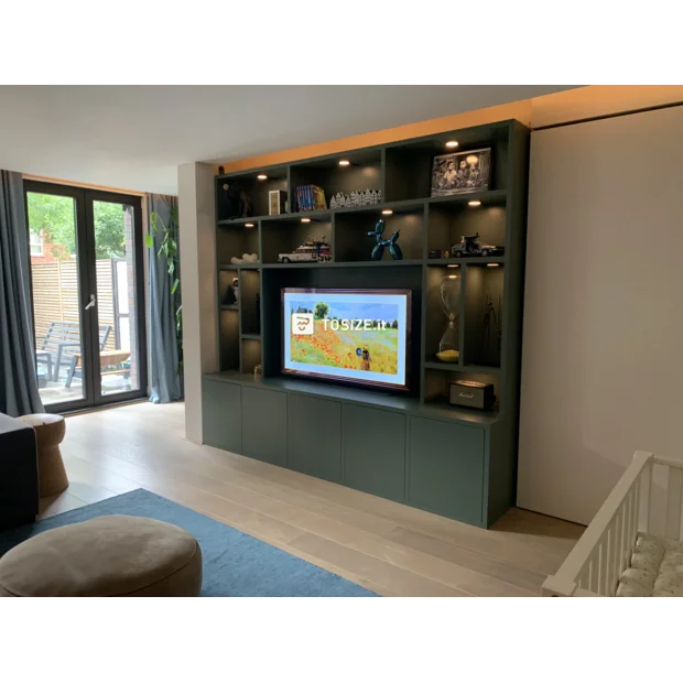 Green cupboard wall with open compartments and doors