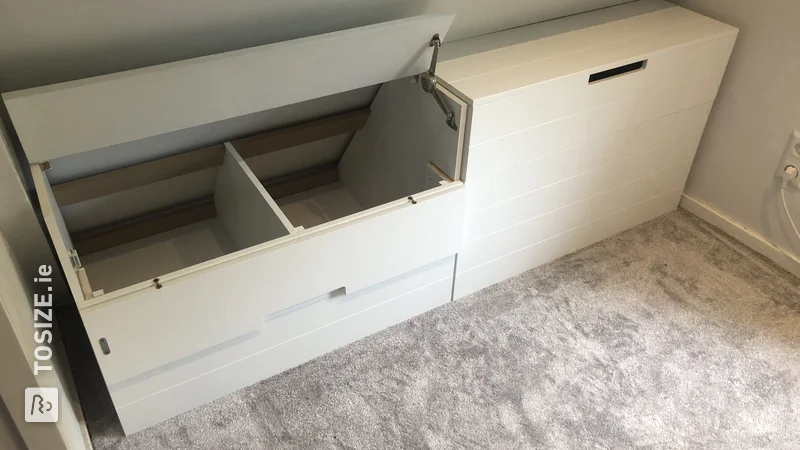 A super smart custom storage cupboard under a sloping roof, by Maurits