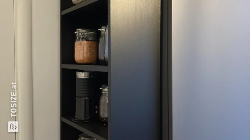 A custom-made kitchen cabinet that fits exactly, by Laura