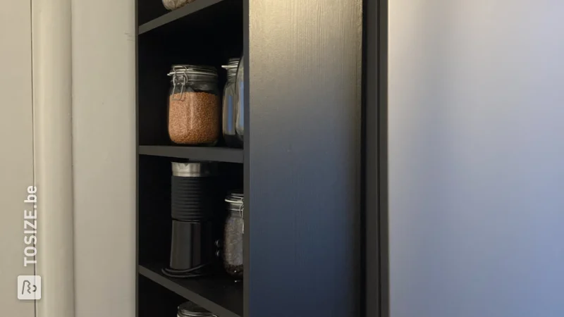 A custom-made kitchen cabinet that fits exactly, by Laura