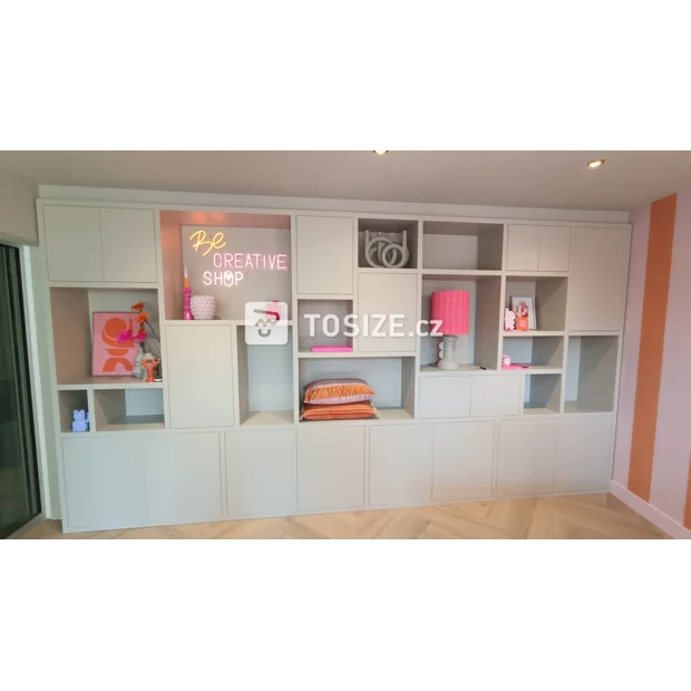 Light gray cupboard wall with doors and open compartments