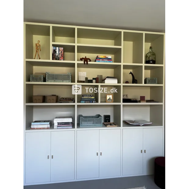 Light (wood) cupboard wall with doors and open compartments