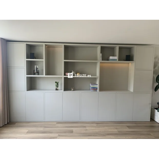 Light (wood) cupboard wall with open compartments and doors