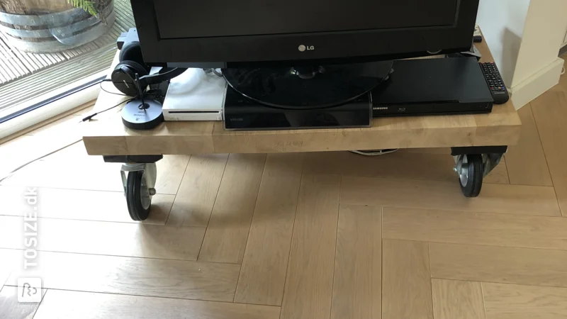 A homemade TV cabinet made of custom oak carpentry panel, by Walter