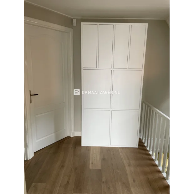 White cabinet with doors and open compartments