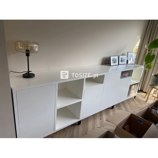 White cupboard wall with doors and open compartments