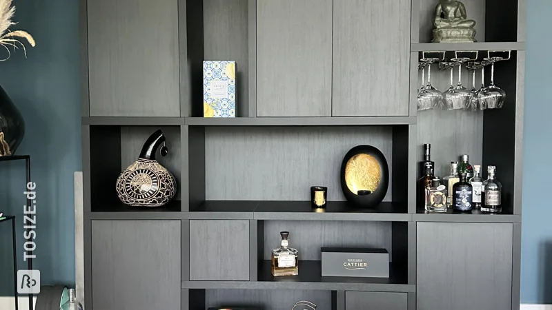 A large TOSIZE Furniture custom dream cupboard in black oak, by Sander