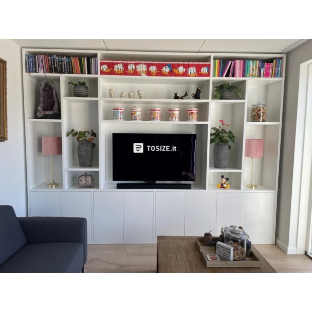 White cupboard wall with open compartments and doors