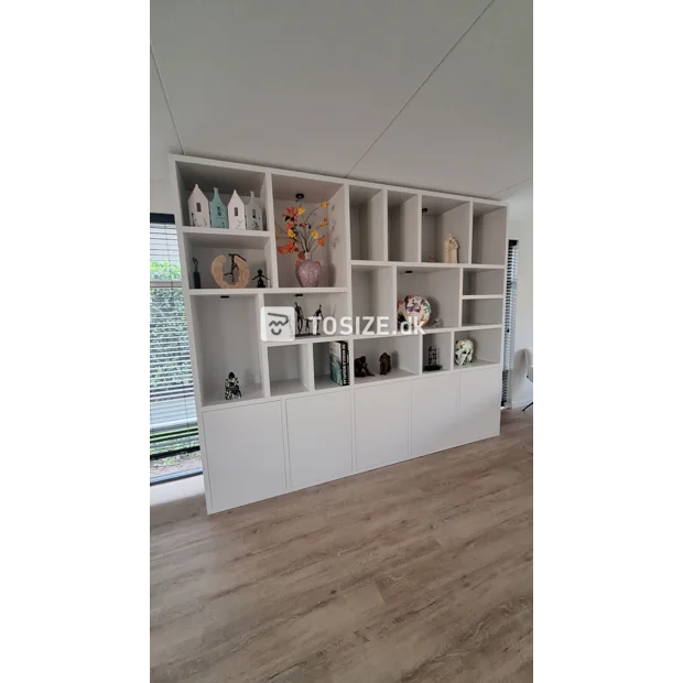 White cupboard wall with open compartments and doors