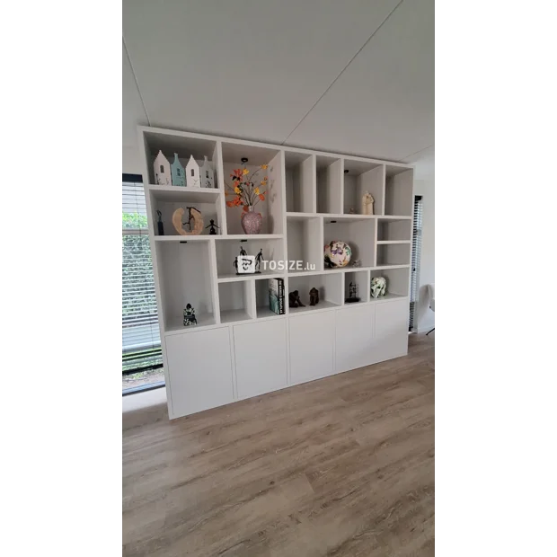 White cupboard wall with open compartments and doors