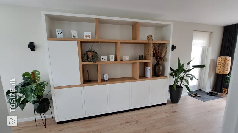 Wall cabinet with white and natural oak panels, by Wim and Elly