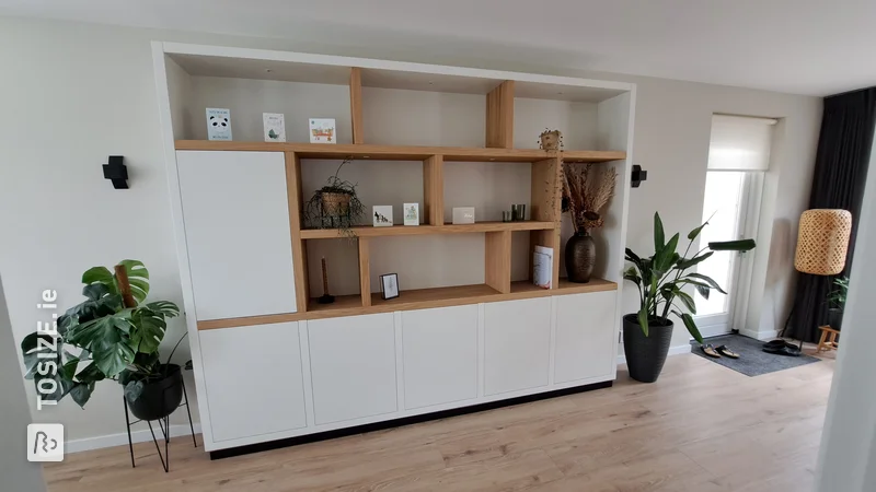 Wall cabinet with white and natural oak panels, by Wim and Elly