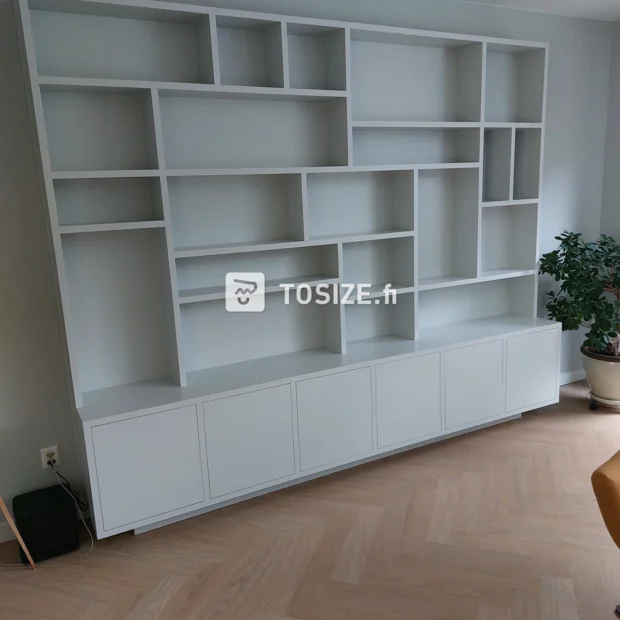 White cupboard wall with doors and open compartments