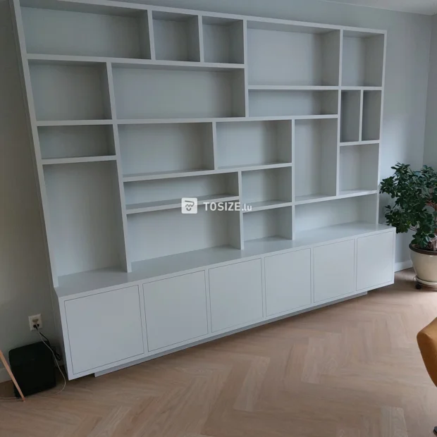 White cupboard wall with doors and open compartments