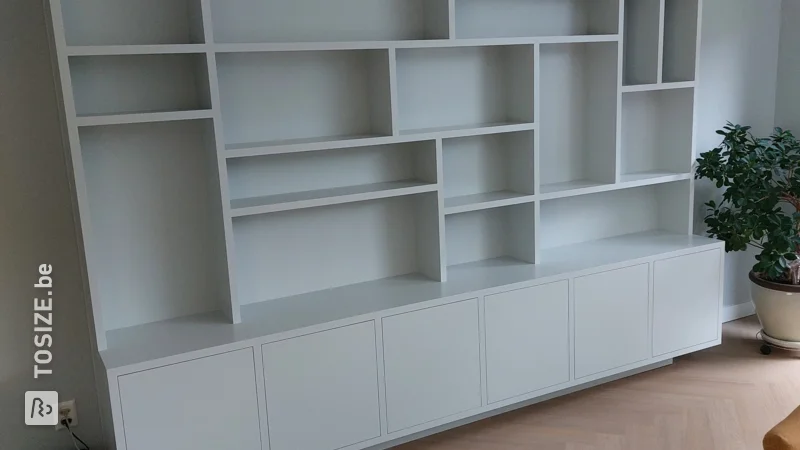 A TOSIZE furniture shelving unit with different depths, by Ruud