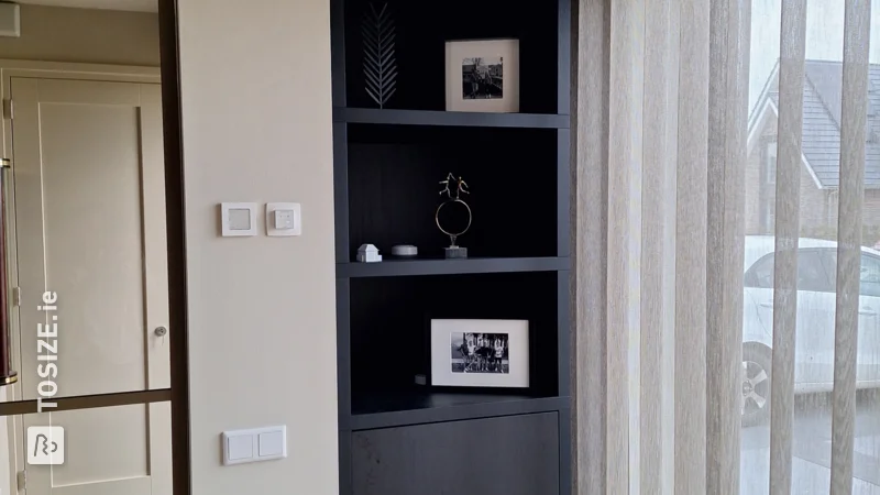 Custom furniture, cupboard in alcove in living room