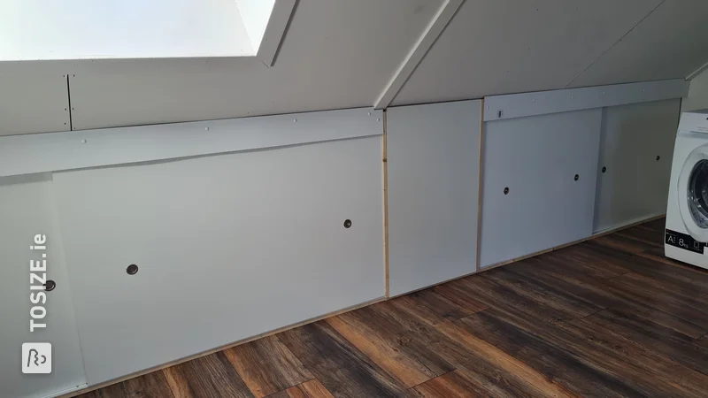 Custom sliding doors with wood for a cupboard in the attic, by Benjamin