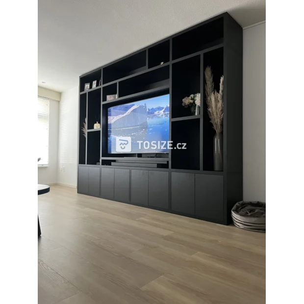 Black cupboard wall with doors and open compartments