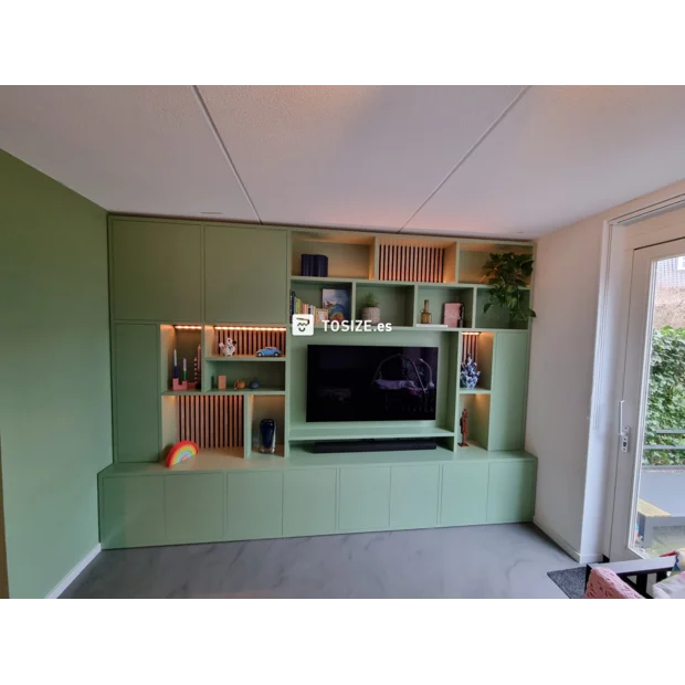 Green cabinet with open compartments and doors