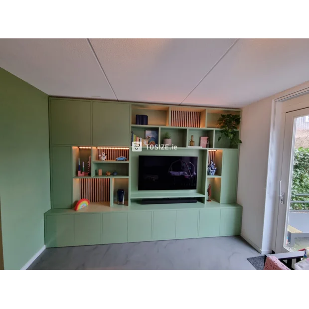 Green cabinet with open compartments and doors