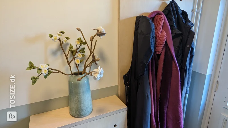 Pegboard coat rack and shoe cabinet, by Linda