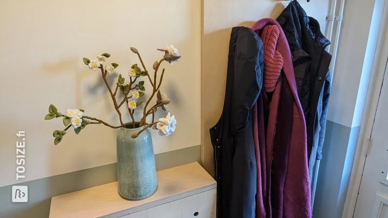 Pegboard coat rack and shoe cabinet, by Linda